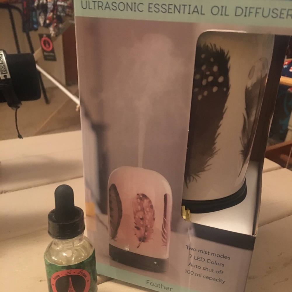 Essential oil diffuser and bottle of peppermint